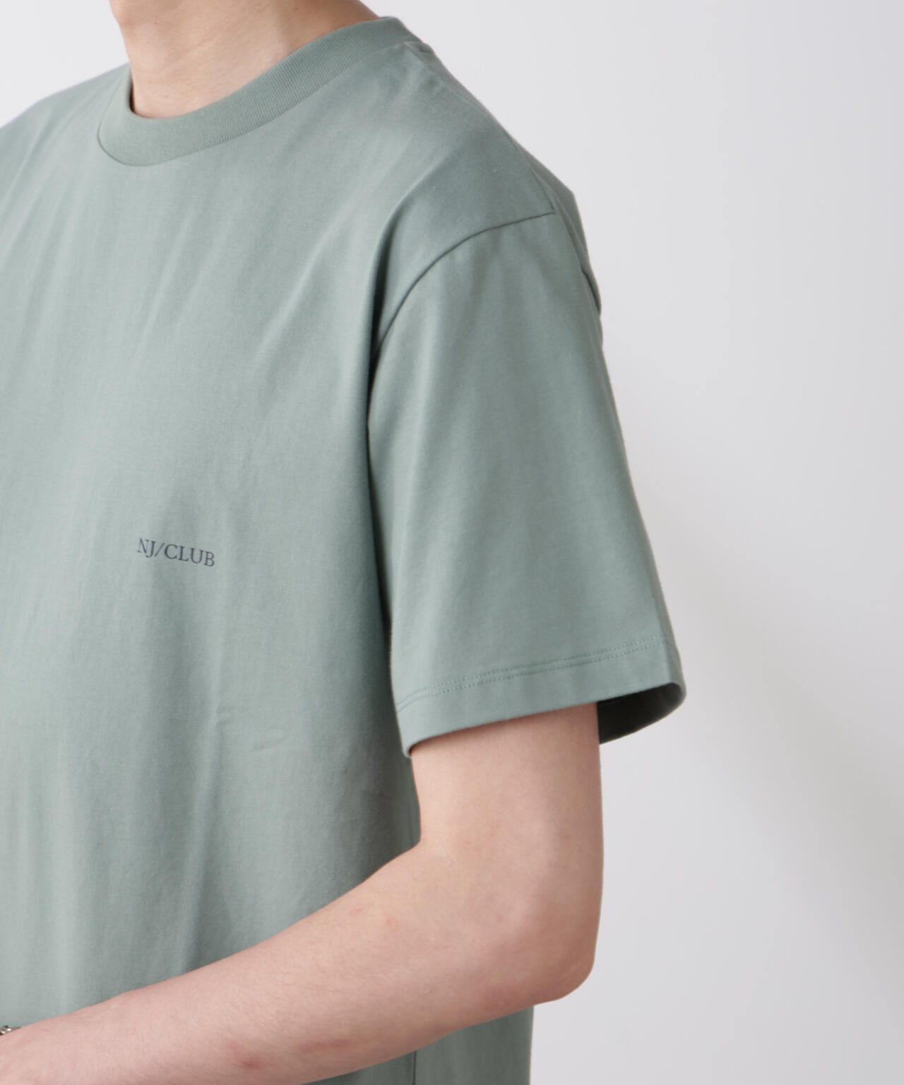 「NJ/CLUB」 ISLANDCLUBプリント Tシャツ