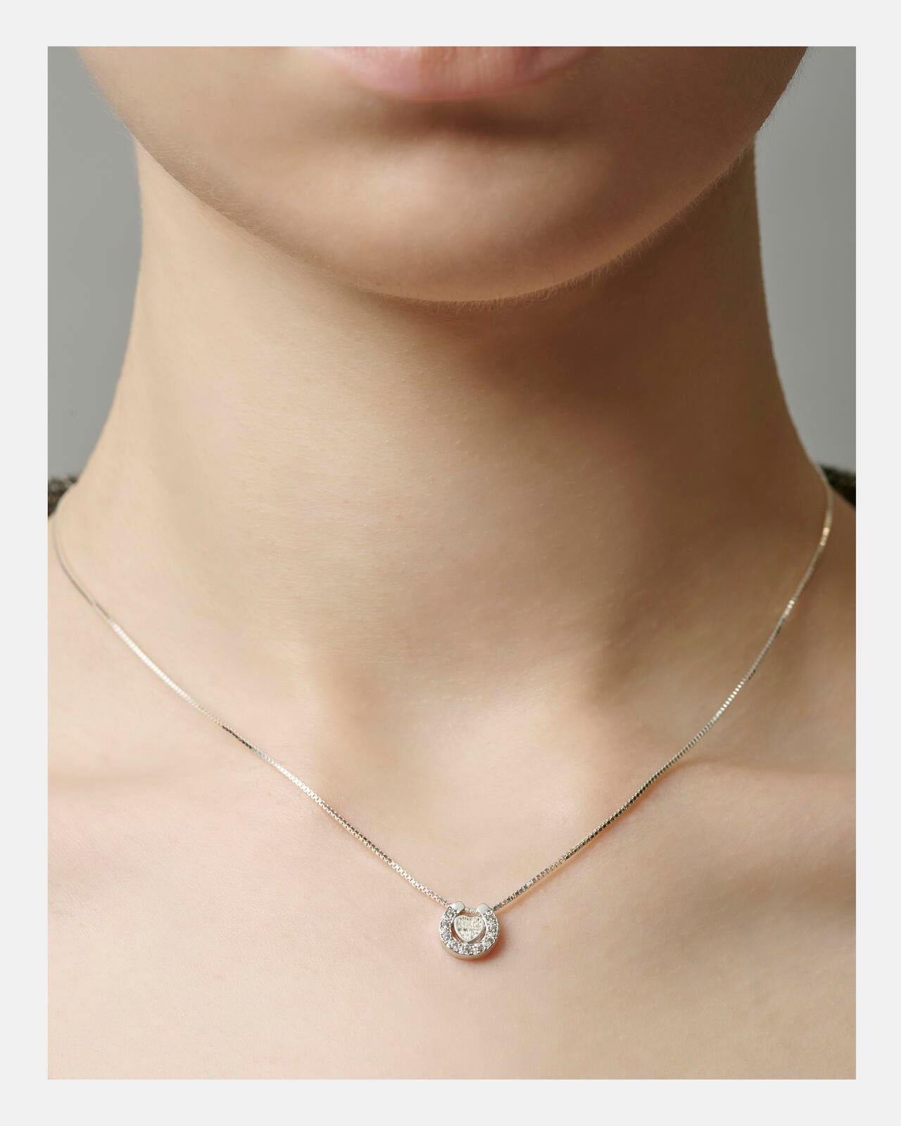 HEART HORSESHOE CZ NECKLACE（SILVER) by J.H.M CO.LTD.